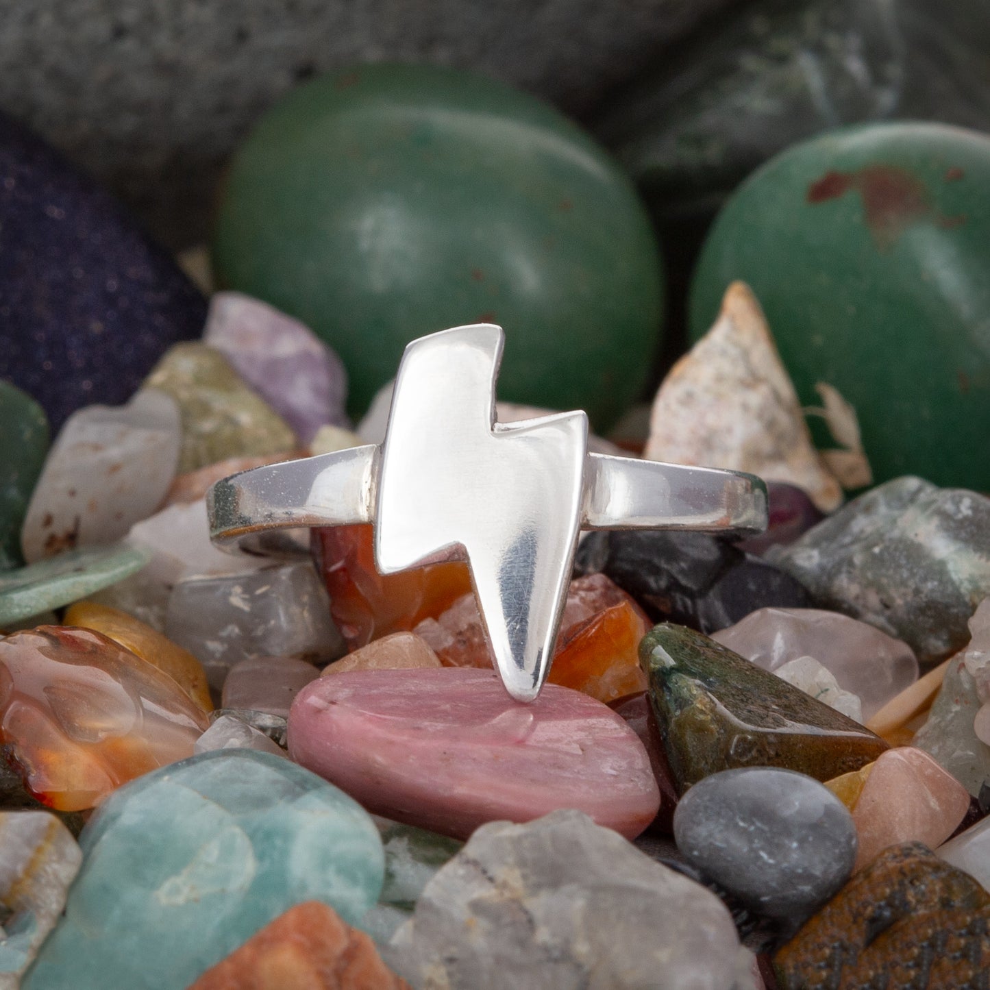 Statement ring. Hand-sawn lightning bolt on a hammered band, polished to a high shine.