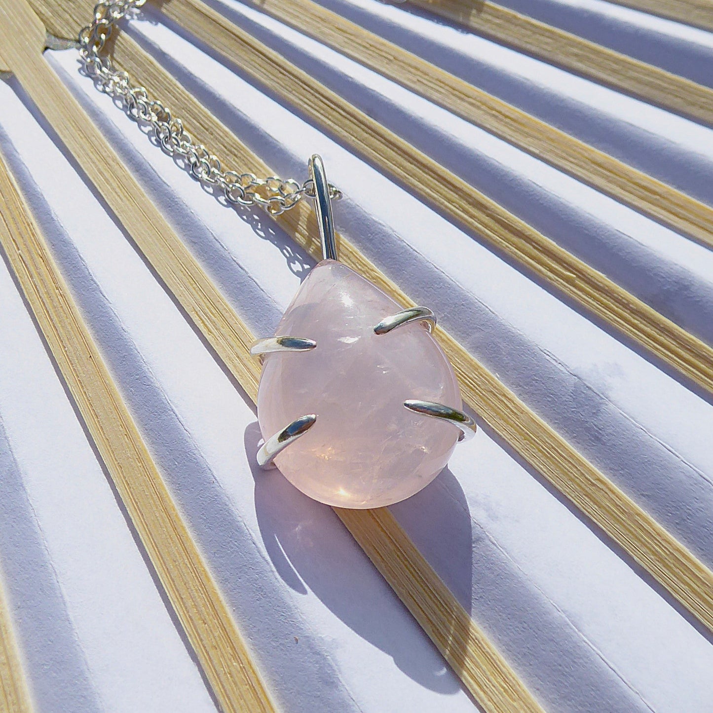 Teardrop shaped Rose Quartz stone set in Sterling Silver. Handmade one of a kind pendant.