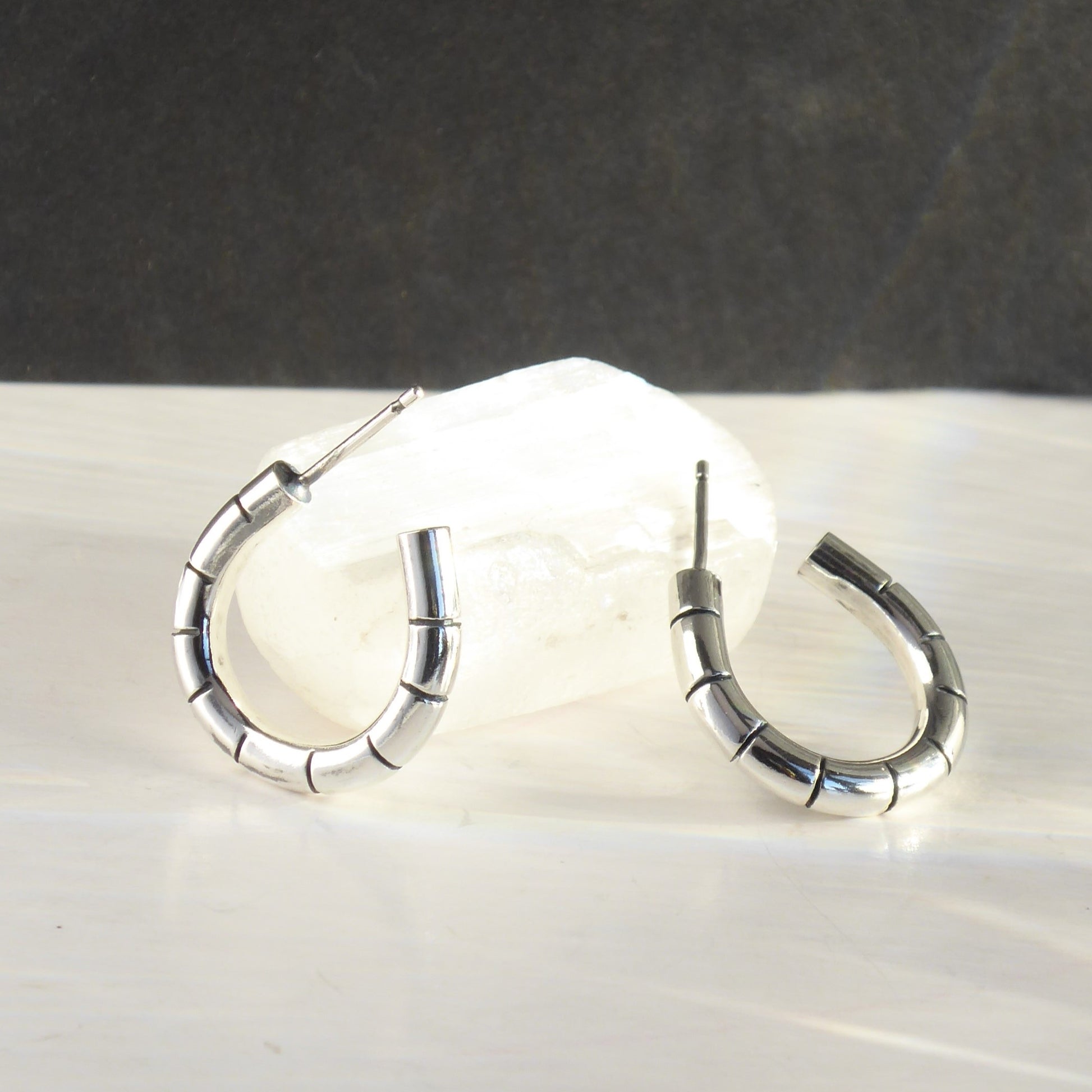 Solid silver statement hoops with hand carved bamboo stripe detail. Handmade from recycled sterling silver