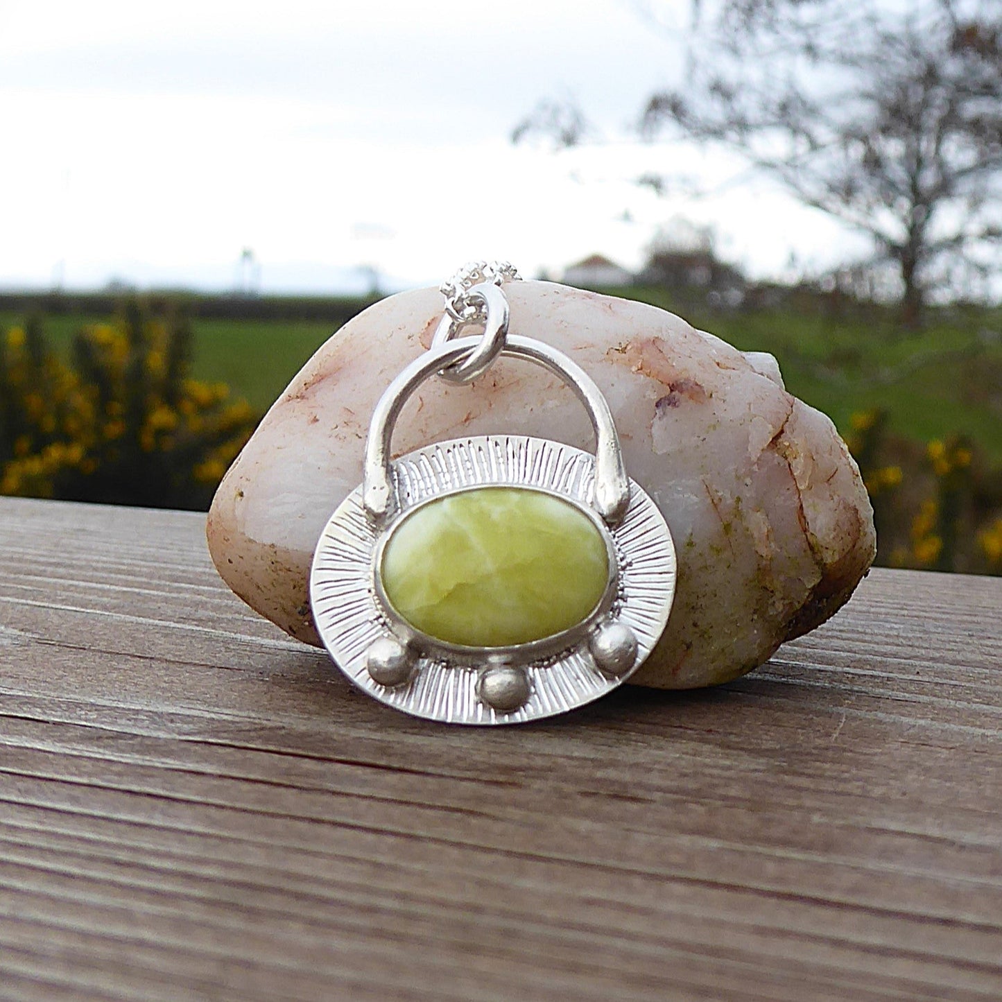 Oval shaped Scottish Marble set in 925 Sterling silver pendant with engraved detailing giving shimmer effect. Granulation detail.